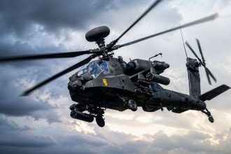 Apache attack helicopter flying through the sky