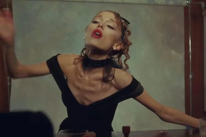 Ariana Grande in The Boy Is Mine music video wearing a black dress