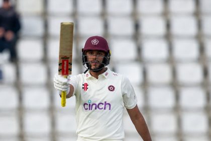Emilio Gay celebrates with his bat during the County Championship