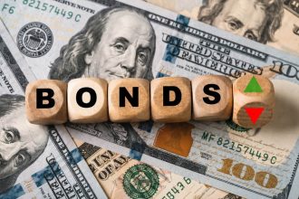 Bonds represented by wooden blocks on U.S. dollar banknotes