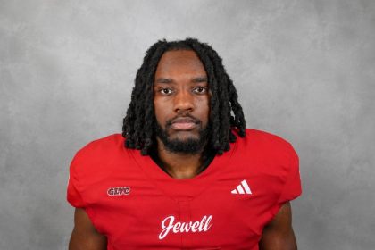 William Jewell College running back MicahJo Barnett in a red football jersey.