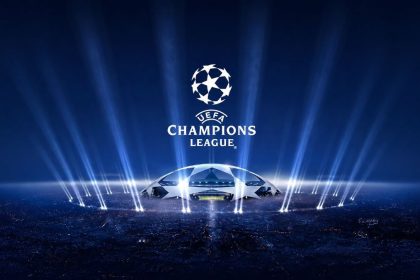 UEFA Champions League logo and star-ball design displayed above a illuminated stadium scene.