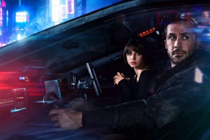 Blade Runner 2049 characters inside a futuristic vehicle at night