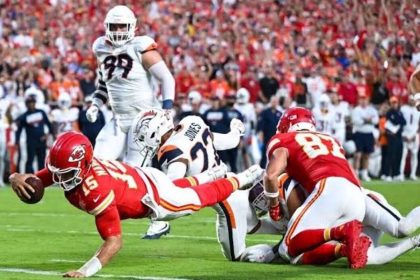 Patrick Mahomes dives for a touchdown against the Denver Broncos.