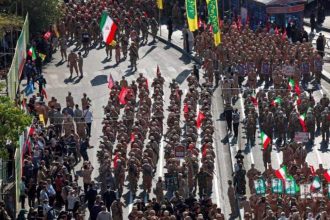 Iranians rally during a volunteer mobilization event in Tehran.