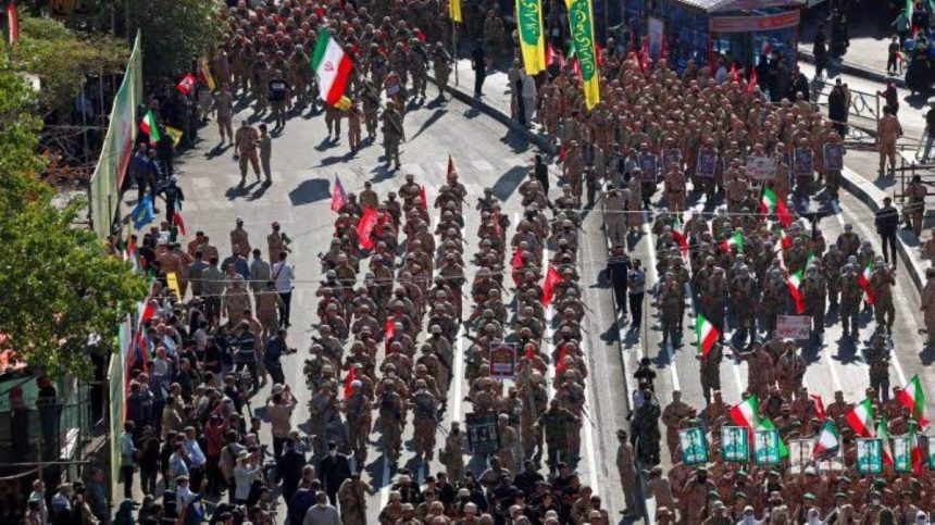 Iranians rally during a volunteer mobilization event in Tehran.