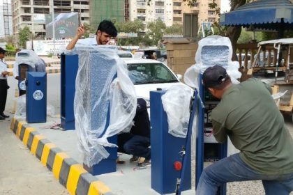 Karachi digital parking system being installed at a KMC parking site.