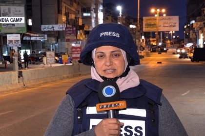 Palestinian-American journalist Naqaa Hamed reporting in Qalandia Camp.