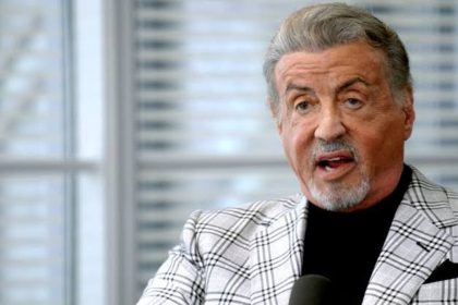 Sylvester Stallone speaking during an interview.