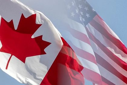 Canada and U.S. flags displayed together, illustrating the relationship between the two countries.