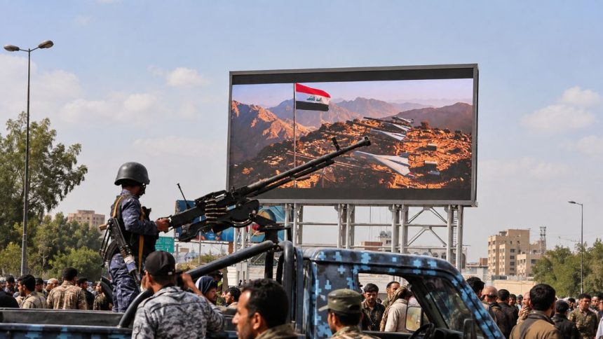 Houthi security member mans machine gun on patrol vehicle in Sanaa