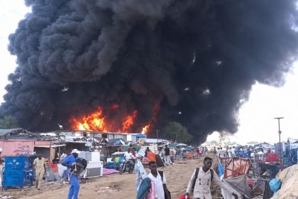 Thick black smoke rises above burning structures at Amiet Market in the disputed Abyei Area.