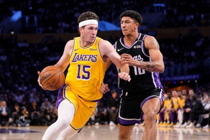 Lakers guard Austin Reaves dribbles past Sacramento Kings guard Nique Clifford during a preseason game at Crypto.com Arena.
