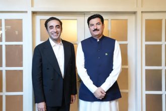 PPP Chairman Bilawal Bhutto Zardari and Khyber Pakhtunkhwa Governor Faisal Karim Kundi pose together indoors.