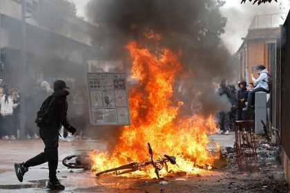 Students protest outside a school during demonstrations in France.
