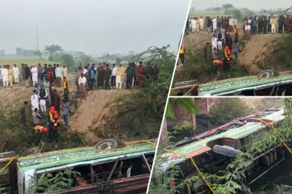 Overturned passenger bus in a ditch as rescue workers and residents gather at the scene of the Hafizabad bus crash.