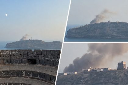 Smoke rises above buildings near Al-Maashiq Presidential Palace after a reported Houthi attack.