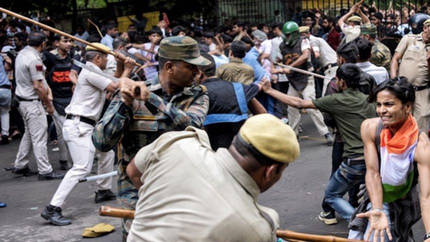 Delhi police officers wield batons as protesters confront security personnel during a street demonstration in India.