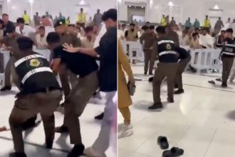 Saudi security forces detain a man during an incident at the Grand Mosque in Makkah.