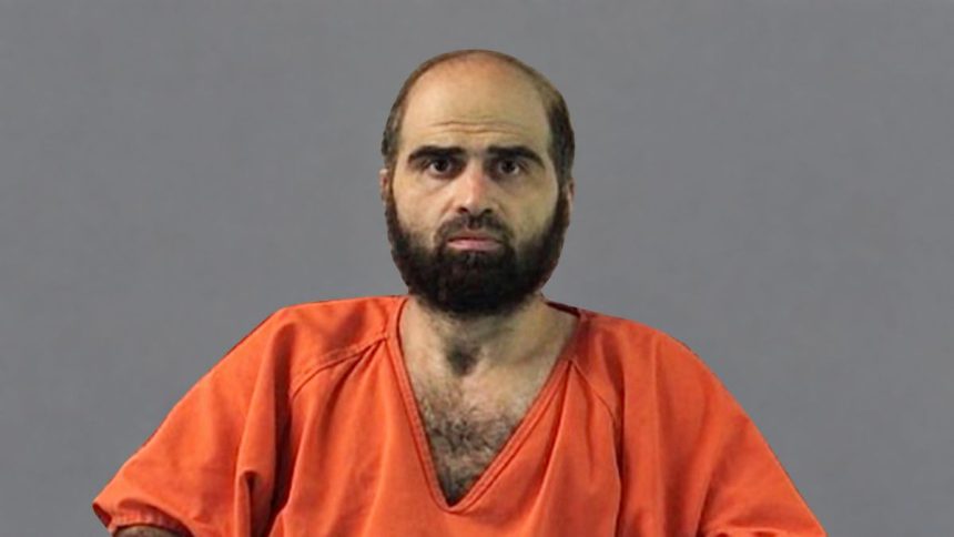 Former Army psychiatrist Nidal Malik Hasan wearing an orange prison uniform.