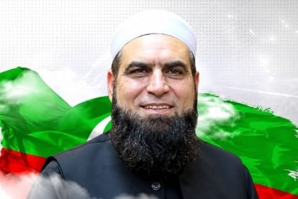 PTI MPA Dr. Amjad Ali wearing a white cap and black waistcoat.