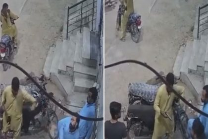 CCTV still showing men gathered around motorcycles outside a residential building in Nazimabad No. 1, Karachi, during a reported armed robbery.