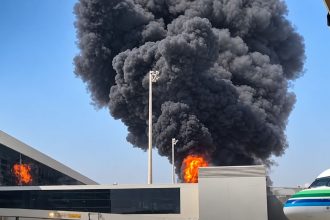 Black smoke and flames rise near King Khalid International Airport in Riyadh, Saudi Arabia, after reported attacks by Yemen’s Houthis.