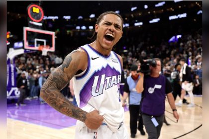 Utah Jazz guard Keyonte George celebrates in his white No. 3 jersey after a 120–119 win over the New Orleans Pelicans.
