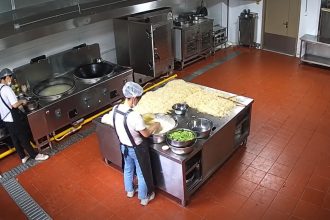 CCTV footage allegedly shows a chef adding a substance to food in a kindergarten kitchen in China.